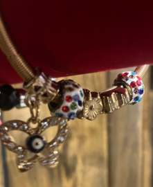 Bracelet-Gold spring band with multi-colored beads