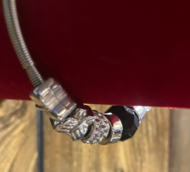 Silver stretch spring bracelet w black & silver charms